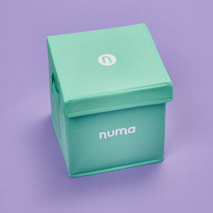 happy mama kit closed with purple background. 12 childbirth recovery essentials, all in one kit